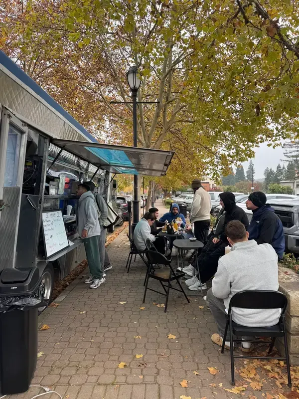 Customers enjoying the Hummus Bodega food truck